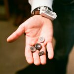 a person with two buttons in their hand